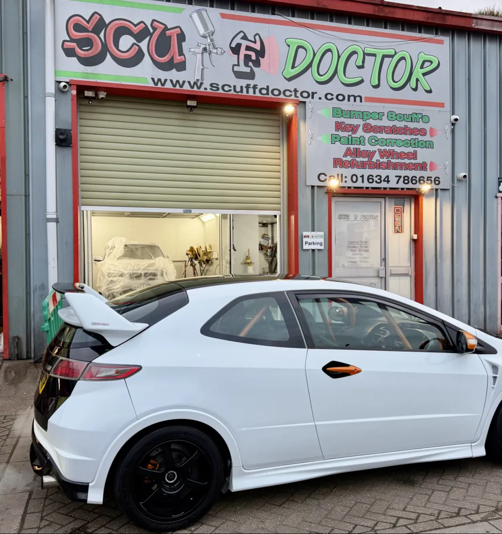 The Scuff Doctor unit on Whitewall Road, Medway City Estate: a large Scuff Doctor sign above the roller door listing bumper scuffs, key scratches, paint correction and alloy wheel refurbishment, with a white Honda Civic parked outside.